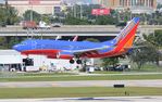 N286WN @ KFLL - SWA 737 canyon blue zx FLL 28R - by Florida Metal