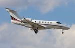N348QS @ KORL - Phenom 300 zx - by Florida Metal