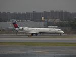 N937XJ @ JFK - Taxiing at JFK - by Arthur Tanyel