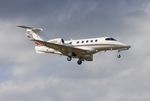 N392QS @ KORL - Phenom 300 zx - by Florida Metal