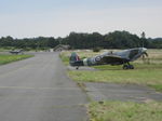 LN-BSP @ EKVL - Spitfire LN-BSP and Mustang LN-BMU in the background 
arriving at an airshow at Vaerloese, Denmark after landing on 
Runway 10. Spitfire built in 1945 as RAF RW386 / NG-D. - by Jan Lundsteen-Jensen