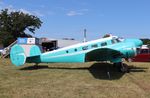 N411J @ KOSH - Beech D18S - by Mark Pasqualino