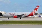 C-FYJH @ KMIA - Rouge A319 taxying for departure - by FerryPNL