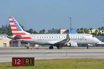 N217NN @ KMIA - Eagle flight ERJ175 lined-up - by FerryPNL