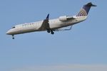 N912SW @ KORD - Skywest / United Express  Bombardier CRJ-200LR on approach KORD - by Mark Kalfas