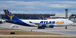 N419MC @ KPSM - GIANT8433 turns into the cargo ramp, while 2 other Atlas carriers sit at the terminal. - by Topgunphotography