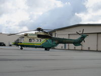 N952JH @ 1938 - Parked with exhaust covered tailboom - by 30295