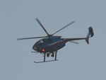 N5284F - Houston Police Department's MD500E was circling around the western part of the Timbergrove neighborhood after 7 PM, down to 600 feet. Nikon D7100, 200mm lens, f/6.3, 1/640, ISO-200; cropped to enhance detail. - by whennegan