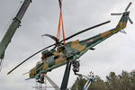 005 - Displayed as a memorial on the road leading to the former Szentkirályszabadjai Airport. It was given page number 005 in memory of the first Mi-24 combat helicopter to arrive in Hungary. Installation moments. - by Attila Groszvald-Groszi