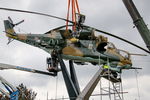 005 - Displayed as a memorial on the road leading to the former Szentkirályszabadjai Airport. It was given page number 005 in memory of the first Mi-24 combat helicopter to arrive in Hungary. Installation moments. - by Attila Groszvald-Groszi