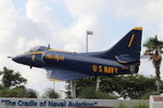 149563 @ KPNS - A US Navy Blue Angels A-4 Skyhawk on display at the entrance to Pensacola International Airport - by Suncoast Spotter