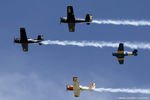N528TC @ KOSH - Formation of trainers