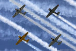 N747JE @ KOSH - Formation of trainers