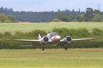 G-AHKX @ EGTH - Landing at Old Warden - by Chris Holtby