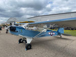 N43NE @ ANE - Is that Piper Cub? Nah. Cubs are yellow.  Is that Navy NE-1?  No it's not a restoration and it's not an L-Bird.  Well, what does it fly like?  What else would it fly like?  It flies like Cub   Sport Aviation February 2006 - by Timothy Aanerud