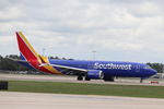 N8702L @ KRSW - Southwest Flight 2176 taxis to the gate at Southwest Florida International Airport following flight from Indianapolis International Airport - by Suncoast Spotter