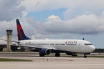 N818DA @ KRSW - Delta Flight 2226 taxis to the gate at Southwest Florida International Airport following flight from Minneapolis-St Paul International Airport - by Suncoast Spotter