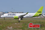 YL-ABM @ LOWW - Rolling on runway 29 with warning sign and the mid-point transmissiometer in the foreground - by Hotshot