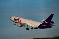 N642FE @ STAN - another shot of this aircraft leaving the runway at stansted airport uk - by david knox