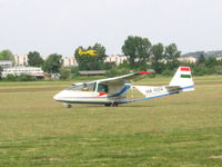 HA-1004 @ LHBS - Taxiing. An EC-135 at the background... - by László Tamás