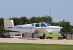 N1954D @ KOSH - Beech C35 - by Mark Pasqualino