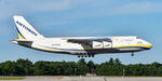 UR-82029 @ KPSM - AN-124 coming in to drop off some hardare - by Topgunphotography