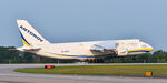 UR-82027 @ KPSM - Loaded down with vehicles, this AN-124 touched down just after the numbers to give him as much runway to slowdown as he needed. - by Topgunphotography