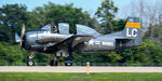 N28LC @ KOSH - landing after group flyover - by Topgunphotography