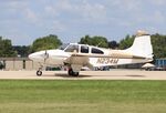 N234M @ KOSH - Beech D95A - by Mark Pasqualino