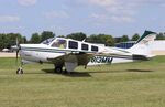 N813MM @ KOSH - Beech A36 - by Mark Pasqualino