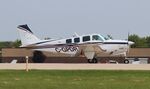 C-GPDR @ KOSH - Beech A36 - by Mark Pasqualino