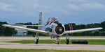 N300JH @ KOSH - T-28 Trojan taxiing off the RW - by Topgunphotography