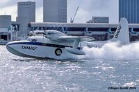 N2974 @ KMPB - Chalk's International Grumman Turbo Mallard N2974 photographed taking of from the Main Channel at Miami on 2nd November 1982, after leaving the company’s terminal at Miami Seaplane Base on Watson Island. - by Roger Syratt