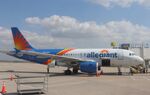 N333NV @ KMOT - Airbus A319-111 - by Mark Pasqualino