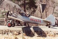 N62834 - Mid 70's Crop-dusting in the little Applegate valley of Southern Oregon near historical Buncom. Of course using the road as a runway. - by Connie Fowler