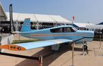 N6767C @ KOSH - Mooney M20C - by Mark Pasqualino