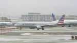 N997AA @ KSFO - Departing runway 10, November rain, 'Pineapple Express' SFO 2024. - by Clayton Eddy