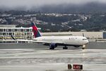 N179DN @ KSFO - Departing runway 10, November rain, 'Pineapple Express' SFO 2024. - by Clayton Eddy
