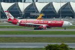 9M-XXZ @ VTBS - AirAsia X A333 applying reverse thrust to come to a stop - by FerryPNL
