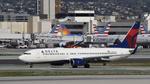 N387DA @ KLAX - Arriving at LAX on 25L - by ToddRoyer