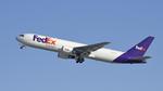 N298FE @ KLAX - Departing LAX on 25L - by ToddRoyer