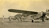 G-EBTS - the Spider on the ground (with the biplane (Gypsy Moth?) that accompanied it on this mission in India in its later years - by Charles Ernest Jones