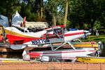 N927GS - Family unloading their supplies after taxiing in and being towed to the dock - by Topgunphotography