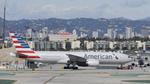 N793AN @ KLAX - Getting towed to gate at LAX - by ToddRoyer