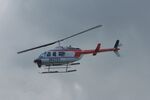 N1076Y - Bell LongRanger flies over San Juan harbor - by Suncoast Spotter