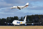 N649QS @ KPSM - landings RW34 while Atlas 747 holds short - by Topgunphotography