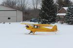 N77500 @ 40I - Cub on Skis - by Jack N. Derrickson