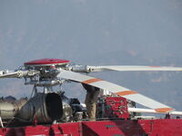 N722HT @ 1938 - Checking blades and for oil leaks prior to take off - by 30295