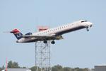 N710PS @ KSRQ - PSA Airlines/ US Airways Express Canadair Regional Jet CRJ-700 N710PS on departure from Runway 14 at Sarasota-Bradenton International Airport - by Suncoast Spotter