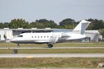 N374G @ KSRQ - Canadair Challenger 604 departs Runway 32 at Sarasota-Bradenton International Airport - by Suncoast Spotter